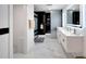 Modern bathroom with double vanity and marble floors at 6208 Spoonbill Dr, New Port Richey, FL 34652
