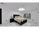 Bright bedroom with wood platform bed and marble flooring at 6208 Spoonbill Dr, New Port Richey, FL 34652