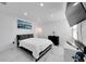 Bedroom with a bed, artwork, and marble floors at 6208 Spoonbill Dr, New Port Richey, FL 34652