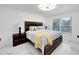 Bright bedroom with a king-size bed and ensuite bathroom at 6208 Spoonbill Dr, New Port Richey, FL 34652