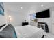 Bright bedroom with a large TV and comfortable bedding at 6208 Spoonbill Dr, New Port Richey, FL 34652
