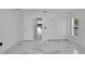 Clean bedroom with white walls and marble tile floors at 6208 Spoonbill Dr, New Port Richey, FL 34652