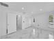 Bright bedroom with white walls and marble tile floors at 6208 Spoonbill Dr, New Port Richey, FL 34652