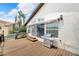 Back deck with grill and sliding glass doors at 6208 Spoonbill Dr, New Port Richey, FL 34652
