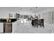Open concept dining area with marble floors at 6208 Spoonbill Dr, New Port Richey, FL 34652