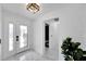 Bright entryway with white tile floors and modern door at 6208 Spoonbill Dr, New Port Richey, FL 34652