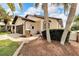 House exterior showcasing a dark brown door and walkway at 6208 Spoonbill Dr, New Port Richey, FL 34652