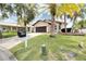 Single story house with a paver driveway and lush lawn at 6208 Spoonbill Dr, New Port Richey, FL 34652