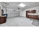 Spacious garage with extra storage cabinets at 6208 Spoonbill Dr, New Port Richey, FL 34652