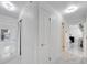 Bright hallway with white walls and marble tile flooring at 6208 Spoonbill Dr, New Port Richey, FL 34652
