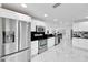 Modern kitchen with stainless steel appliances and white cabinetry at 6208 Spoonbill Dr, New Port Richey, FL 34652