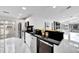 Open concept kitchen boasts stainless steel appliances and a large island at 6208 Spoonbill Dr, New Port Richey, FL 34652