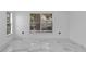 Spacious living room featuring large windows and marble floors at 6208 Spoonbill Dr, New Port Richey, FL 34652