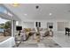 Spacious living room with sectional sofa, large windows, and water view at 6208 Spoonbill Dr, New Port Richey, FL 34652