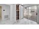 Open pantry with white cabinets and shelving at 6208 Spoonbill Dr, New Port Richey, FL 34652