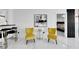 Stylish sitting area with two yellow armchairs and a side table at 6208 Spoonbill Dr, New Port Richey, FL 34652