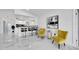 Elegant sitting area with yellow armchairs and kitchen views at 6208 Spoonbill Dr, New Port Richey, FL 34652