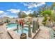 Lush backyard pool area features a relaxing spa, water feature, and tropical landscaping at 8272 Artisan Way, Seminole, FL 33777