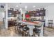 Spacious kitchen with a large island, granite countertops, stainless steel appliances, and dark wood cabinetry at 8272 Artisan Way, Seminole, FL 33777