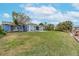 Large grassy backyard with a view of the canal at 911 Silver Palm Way, Apollo Beach, FL 33572