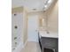 Simple bathroom with single vanity and shower/tub combo at 911 Silver Palm Way, Apollo Beach, FL 33572