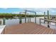 Spacious waterfront dock featuring boat lifts and calm waters at 911 Silver Palm Way, Apollo Beach, FL 33572