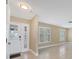 Inviting entryway with tile flooring and elegant glass door at 911 Silver Palm Way, Apollo Beach, FL 33572
