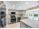 Modern kitchen features stainless steel appliances and granite countertops at 911 Silver Palm Way, Apollo Beach, FL 33572