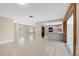 Open concept kitchen with gray cabinets and granite countertops at 911 Silver Palm Way, Apollo Beach, FL 33572