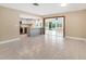 Modern kitchen with island, stainless steel appliances, and water views at 911 Silver Palm Way, Apollo Beach, FL 33572
