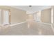 Spacious living area with tile floors and neutral color palette at 911 Silver Palm Way, Apollo Beach, FL 33572