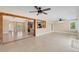 Open living room with views into kitchen and access to exterior at 911 Silver Palm Way, Apollo Beach, FL 33572