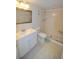 Clean bathroom with shower stall, toilet and vanity at 970 Virginia St # 109, Dunedin, FL 34698