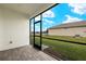 Screened porch with paver floor and backyard access at 12318 Hearts Ease St, Venice, FL 34293