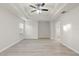 Large bedroom with hardwood floors and ceiling fan at 4104 Warwick Hills Dr, Wesley Chapel, FL 33543