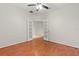 Room with hardwood floors and double doors at 4104 Warwick Hills Dr, Wesley Chapel, FL 33543