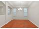 Elegant dining room with hardwood floors and a chandelier at 4104 Warwick Hills Dr, Wesley Chapel, FL 33543