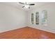 Spacious living room featuring hardwood floors and large windows at 4104 Warwick Hills Dr, Wesley Chapel, FL 33543