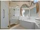 Bathroom featuring a large shower, corner tub, and natural light at 16310 Ashington Park Dr, Tampa, FL 33647