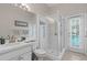 Bathroom with walk-in shower and pool view at 16310 Ashington Park Dr, Tampa, FL 33647