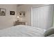 Bedroom with white bedding and double doors at 16310 Ashington Park Dr, Tampa, FL 33647