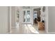 Bright and spacious entryway with tile floors and double doors at 16310 Ashington Park Dr, Tampa, FL 33647