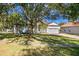 Property exterior, showcasing a well-maintained lawn and driveway at 16310 Ashington Park Dr, Tampa, FL 33647