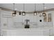 Spacious kitchen with large island, white cabinetry, and pendant lighting at 16310 Ashington Park Dr, Tampa, FL 33647