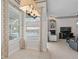 Charming kitchen nook with a view, window seating, and elegant light fixture at 16310 Ashington Park Dr, Tampa, FL 33647