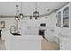 Bright kitchen with white cabinets, stainless steel appliances and large island at 16310 Ashington Park Dr, Tampa, FL 33647