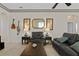 Comfortable living room with a large mirror and ample seating at 16310 Ashington Park Dr, Tampa, FL 33647