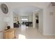 Living room with a piano, access to the backyard, and tile floors at 16310 Ashington Park Dr, Tampa, FL 33647