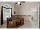 Home office with wooden desk and access to bathroom at 16310 Ashington Park Dr, Tampa, FL 33647
