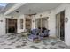 Relaxing patio with tiled floor and comfortable seating at 16310 Ashington Park Dr, Tampa, FL 33647